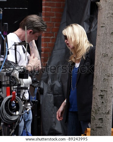 NEW YORK CITY - APRIL 15: Former SVU star Stephanie March (R) admires a tattoo on the arm of a crew member on the set of \