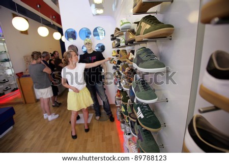 BUDAPEST, HUNGARY - JULY 18: Lovers of retro style footwear shop at the Tisza shoe store in Budapest, Hungary, on Monday,  July 18, 2011. Tisza is a leading brand of retro designed footwear.