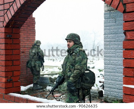 TUZLO, BOSNIA - JAN 26: United States Army troops, in Bosnia as part of NATO\'s IFOR,  protect a front-line headquarters position near Tuzla, Bosnia, on Thursday, January 26, 1995.