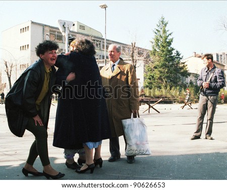 SARAJEVO, BOSNIA - APR 24: Women collapse in tears after being reunited with loved ones in front of a French UNPROFOR checkpoint in Sarajevo, Bosnia, on Sunday, April 24, 1994.