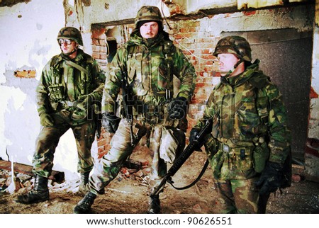 TUZLA, BOSINA - JAN 26: United States Army troops, in Bosnia as part of NATO\'s IFOR,  protect a front-line headquarters position on January 26, 1995 in Tuzla, Bosnia.