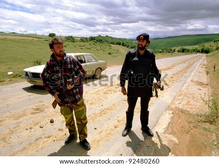 DRENICA, KOSOVO - JULY 7: Guerrillas with the Kosovo Liberation Army (KLA) at a checkpoint near the town of Sirbica on July 7, 1998 in Drenica, Kosovo