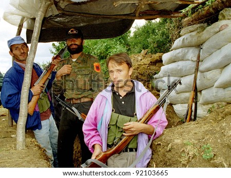 RUDNIK, KOSOVO, 09 JULY 1998 -  Kosovo Liberation Army fighters pause during heavy fighting with Serb security forces for the strategic city of Pec. (C) Photo Credit: Mark H. Milstein/ Northfoto
