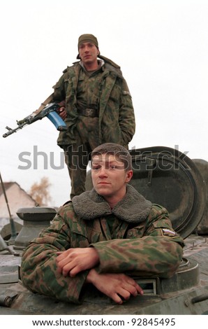 INGUSHETIA-CHECHEN BORDER - NOVEMBER 10: Russian army troops pass through a border checkpoint on their way to front-line positions in Chechnya on November 10, 1999 in Ingushetia - Chechen Border