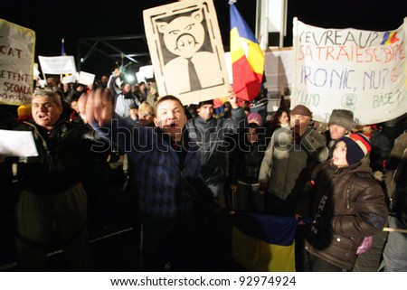 BUCHAREST, ROMANIA - JAN 17: Thousands of demonstrators protest against a series of unpopular austerity measures enacted by the Romanian government in Bucharest, Romania, on Tuesday, January 17, 2012.