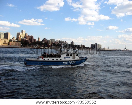 NYC - JULY 14: A New York City Police boat patrols  the East River  in New York City, New York, on Wednesday, July 14,  2009.