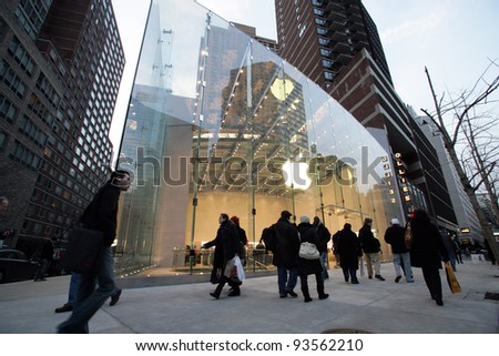 NYC - DEC 30: Pedestrians walk past an official Apple, Inc.  retail center in New York City, New York, on Wednesday,  December 30, 2009.
