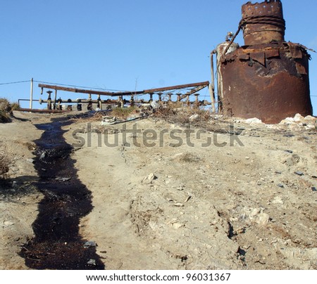 BAKU - AZERBAIJAN - FEB. 4: Crude oil leaks from rusting valves and pipes at a producing oil field near Baku, Azerbaijan, on Wednesday, February 4, 2009.