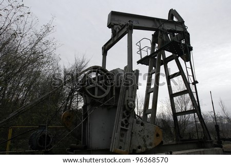 SOUTH CENTRAL RUSSIA - NOV 8: A lone pump jack owned and operated by Romanian oil and gas company S.C. Petrom S.A. pulls crude oil out of the ground near Ploiesti, Romania, on Thursday, November 8, 2007.