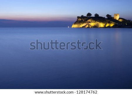 An old castle at the night sea
