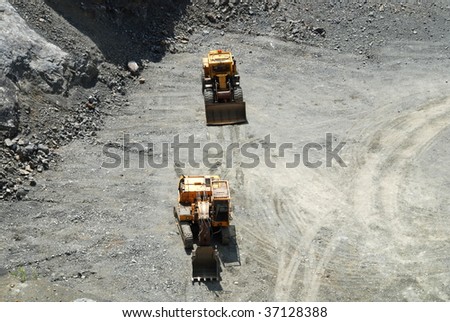 Old coal mine with machines gathering the resources