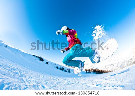 Girl Snowboarder Having A Great Time Jumping