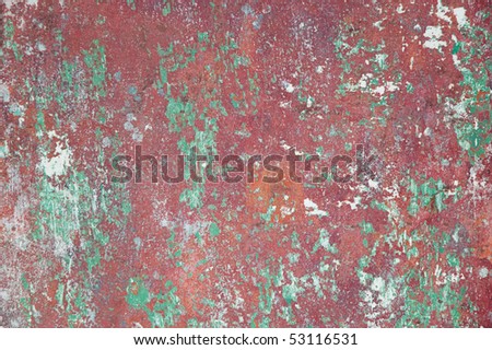 detail of red-green worn down boat painting