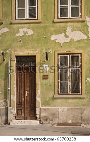 old door and window of green building