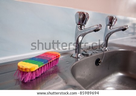 colorful dish brush on the sink
