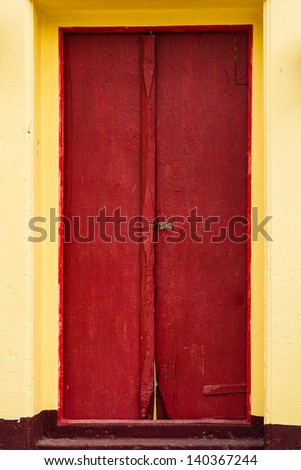 Traditional Thai style red door and window.