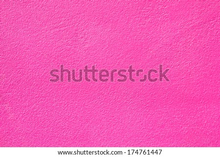 Background of wall built of concrete and painted pink.