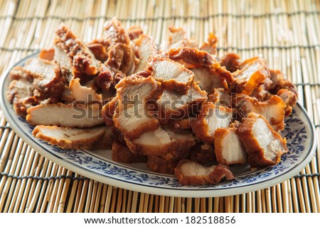 Pork and pork belly fried on a plate.