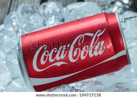 BANGKOK, THAILAND - MARCH 21, 2014 : Can of Coca-Cola on ice. Coca-Cola is the one of the worlds favorite soft drinks.