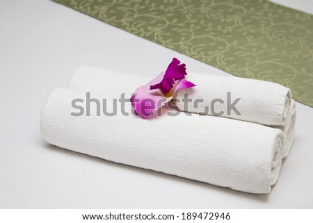 Towels on bed at luxury hotel room