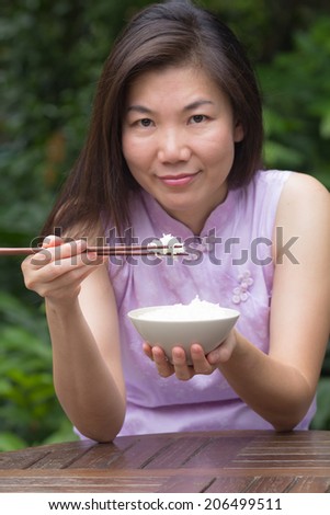 Beautiful young women  are eating rice in restaurant