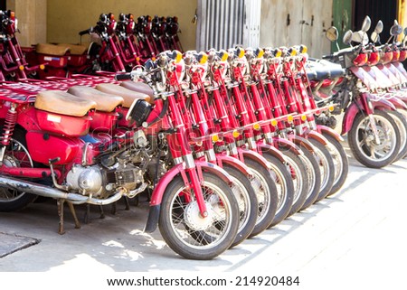 PHNOM PENH, CAMBODIA - AUGUST 18 : Colorful motocycles show in vintage motorbike shop in old market town Phnom Penh, Cambodia on Aug 18, 2014