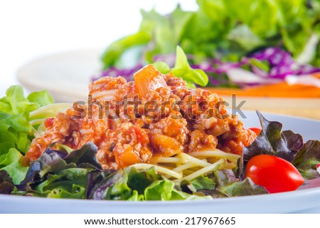 Close up spaghetti sauce sausage with  salad