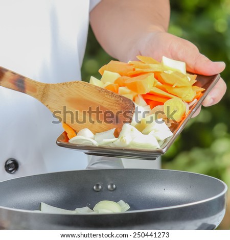 chef cooking for fried vegetable in kitchen outdoor