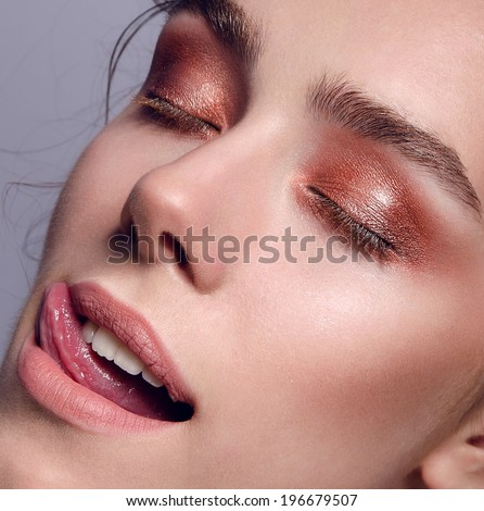 beautiful portrait of the young girl with a natural natural make-up, big eyes and chubby lips, velvet skin