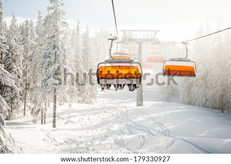 Modern chair ski lift in ski resort in Austria.