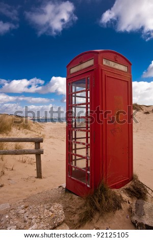 The beach telephone box - an unusual position for a telephone box on the beach at Shell Bay in Dorset