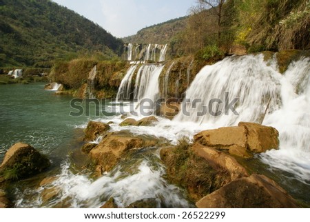 Taken by a wide angle lens in spring. A famous waterfall located in a rural area of China.