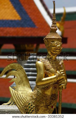 a golden tahi angel statue inside grand palace in Bangkok