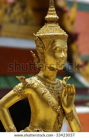a golden thai angel statue inside grand palace in Bangkok