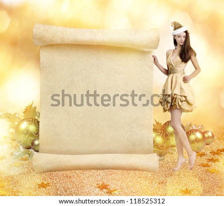 Christmas elf. Young gorgeous women as christmas elf on golden background with blank scroll