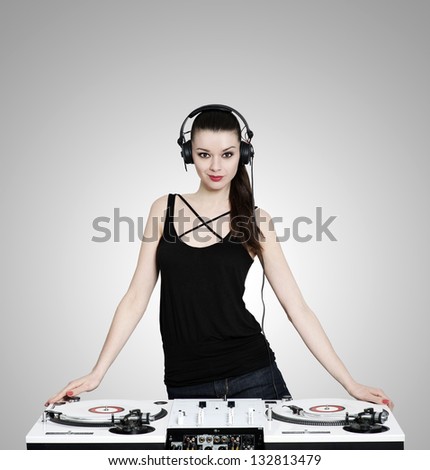 Beautiful Brunette Woman With Headphones And Dj Mixer And Two White Turntables