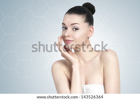 Beautiful young brunette woman portrait - skin care concept