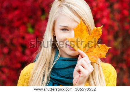 Beautiful young blond woman - colorful autumn portrait