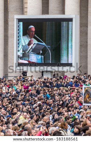 Rome, 23 March 2014: the Faithful in St. Peter\'s Square to hear the Angelus of Pope Francis. Pope Francis to the big screen. March 23, 2014, Vatican City, Italy