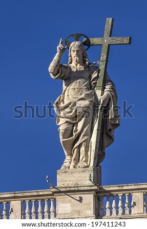 View of the statue of Christ the Redeemer on the balustrade of the baisilica of St. Peter in Rome