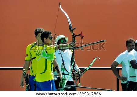 RIO DE JANEIRO, BRAZIL: SEPTEMBER 20, 2015:  Archer Bernardo Oliveira of Brazil ready to shoot arrow at competition against India as part of Archery challenge of AqueceRio test event for 2016 Olympics