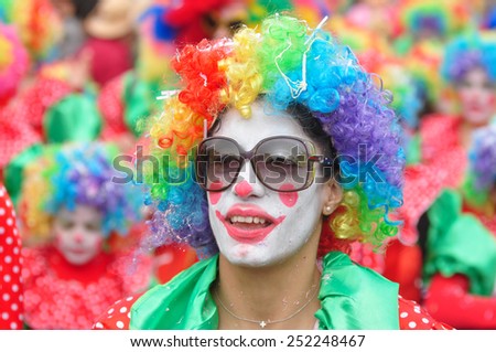 LIMASSOL, CYPRUS - MARCH 2: Unidentified Carnival participants in costume of a clowns march in Cyprus Carnival Parade on MARCH 2, 2014 in Limassol, Cyprus, established in 16th century