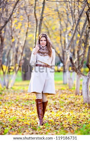 the girl on walk in autumn park