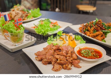 Grill pork with spicy sauce and spicy salmon and spicy crispy pork