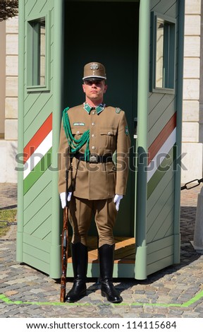 BUDAPEST-MARCH 26: Hungarian guard stood at check-post in front of palace gate at 26 March 2012 in Budapest, Hungary. This Palace has been UNESCO World Heritage site since 2002.