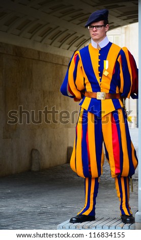 VATICAN - MARCH 26: Famous Swiss Guard on March 26, 2012 in Vatican. The Papal Guard with 110 men probably is the world\'s smallest army.