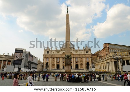 VATICAN CITY, VATICAN - MARCH 23: Tourists at Saint Peter\'s Square on March 23, 2012 in Vatican City, Vatican. Saint Peter\'s Square is among most popular pilgrimage sites for Roman Catholics.