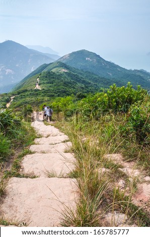 HONG KONG - OCTOBER 19 : Trekker are trekking on Dragon Back trail in Hong Kong on October 19, 2013. Dragon back trail in one of the most famous trekking trail in Hong Kong
