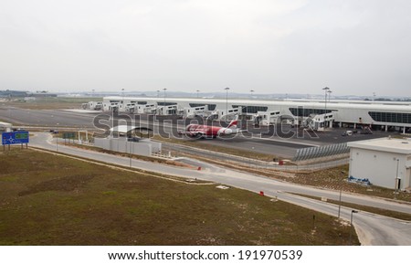 SEPANG, MALAYSIA - MAY 10: Air Asia Airbus 320 taxiing at the new low cost carrier terminal (KLIA2) on May 10, 2014. KLIA2 start operations on May 2, 2014; can accommodate 45 million passengers a year