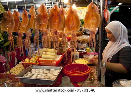 TAIPING, MALAYSIA - DECEMBER 24: Muslim lady preparesg halal Yong Tau Foo on DEC 24, 2011 in Taiping, Malaysia. Yong Tau Foo is a Chinese dish commonly found in China, Singapore, Thailand and Malaysia